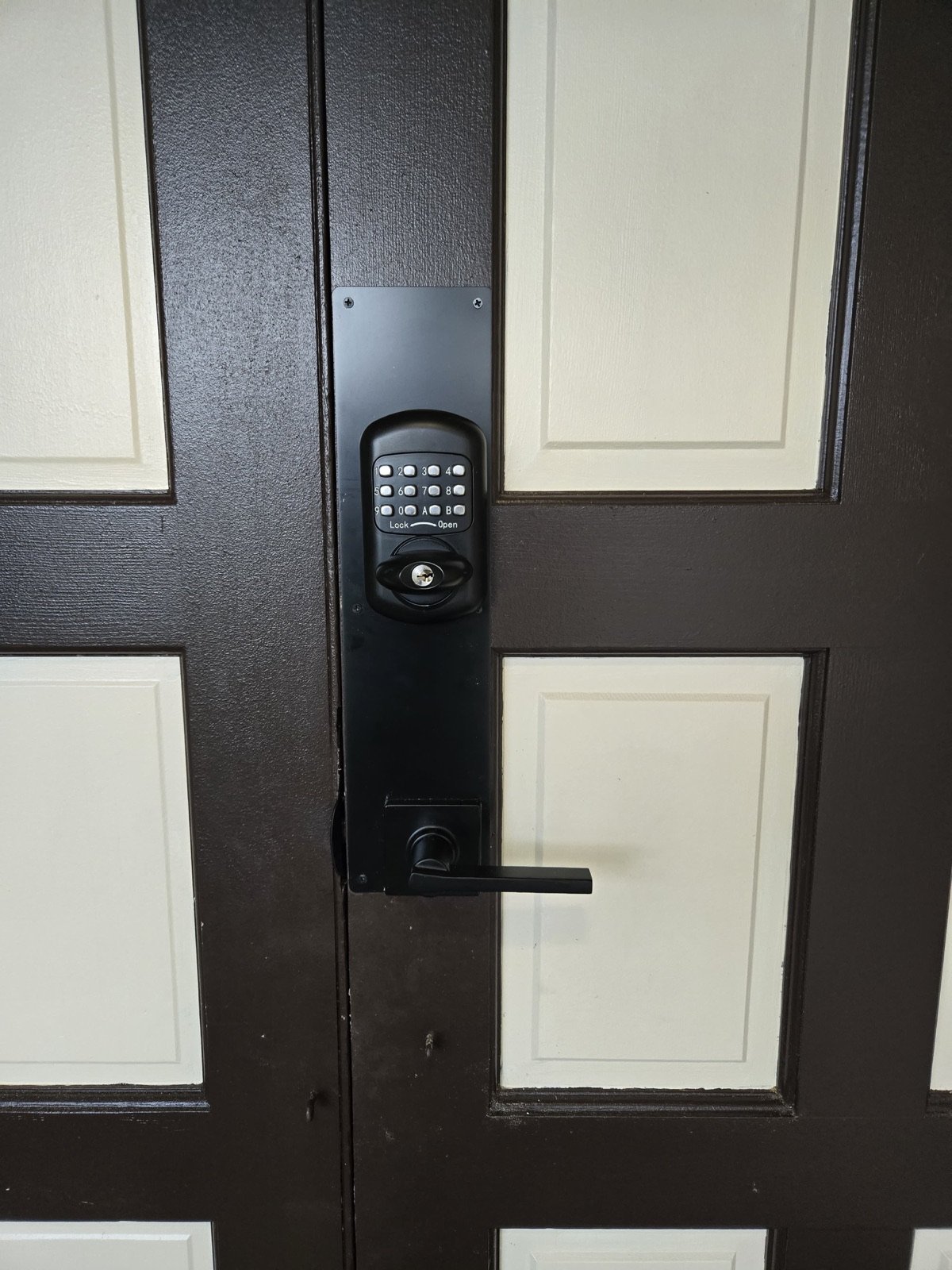 Battery-free mechanical keyless keypad lock installed on double entry doors in Boca Raton