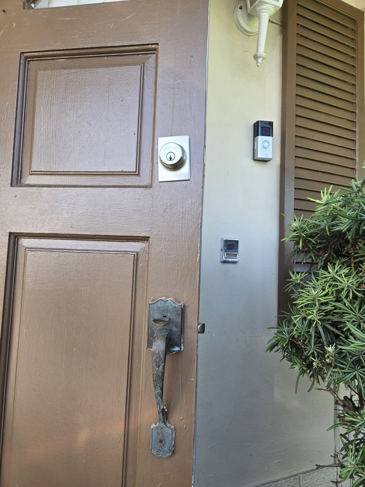 Worn front-door handleset before replacement
