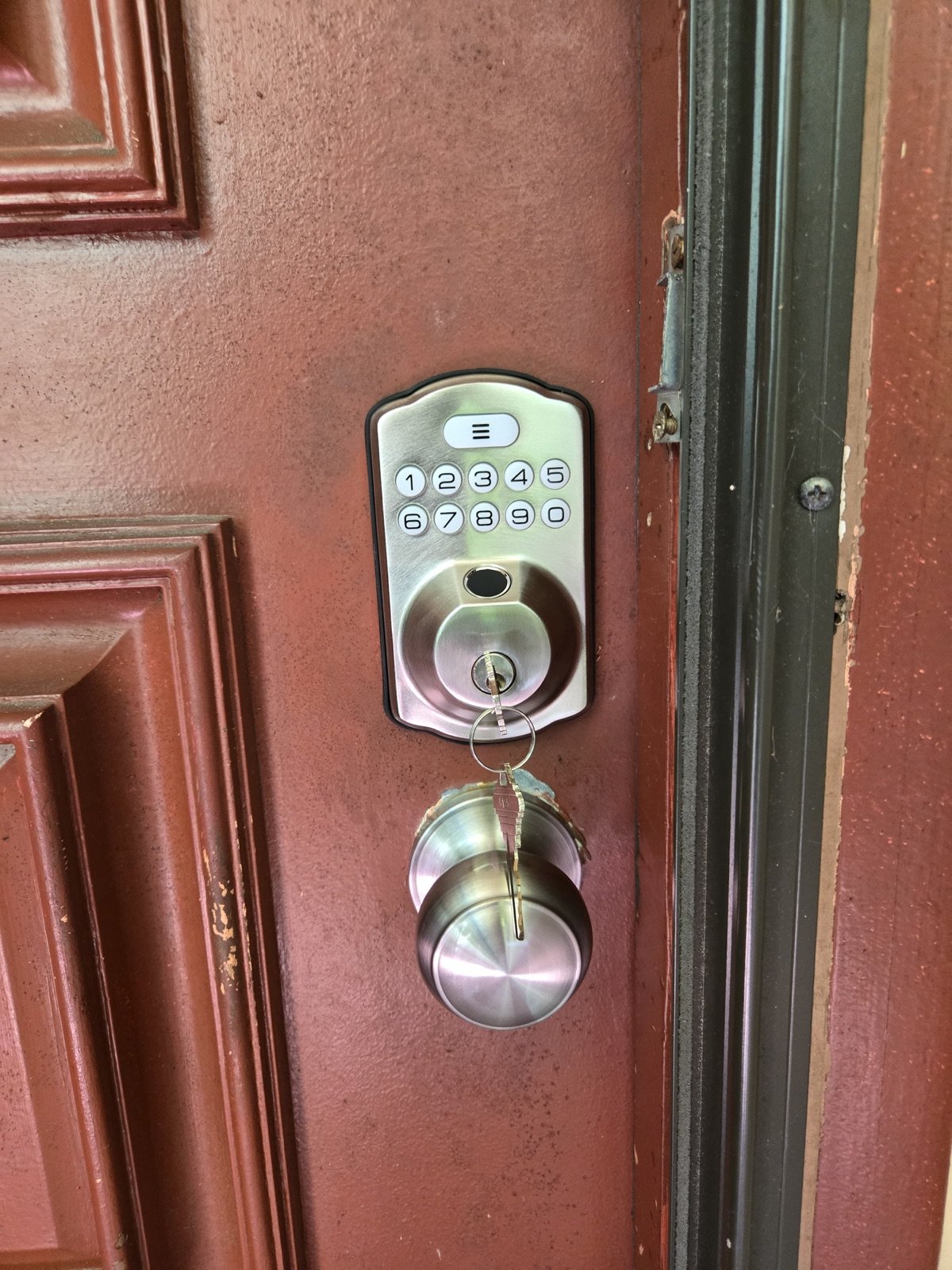 New keypad deadbolt and door knob after residential lock installation